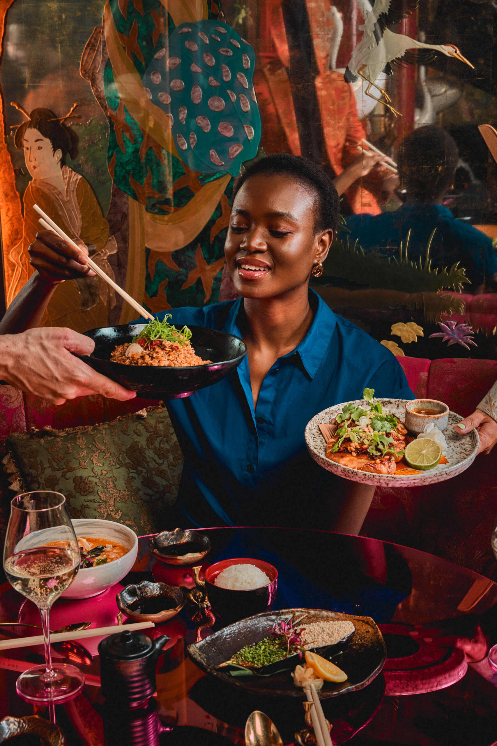 A guest enjoying dinner with friends at The Ivy Asia Manchester.